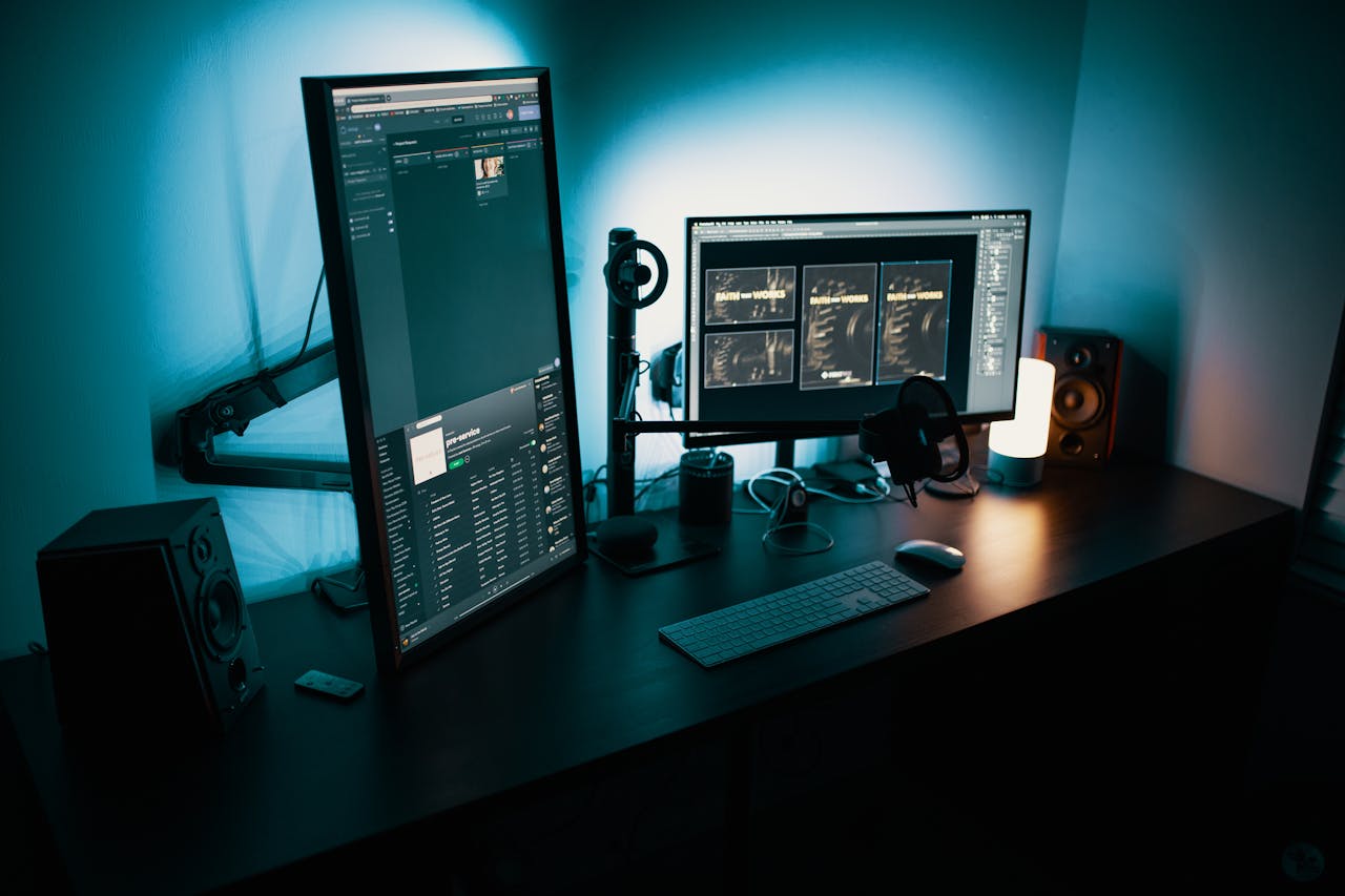 about-us A contemporary office desk featuring a dual monitor setup with stylish lighting, ideal for tech enthusiasts.